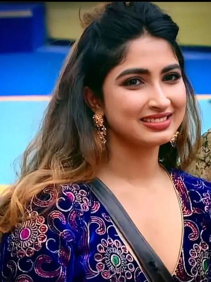 Celebrity Saanya Iyer is seen here wearing one of my custom embroidered outfits during her time on Bigg Boss Kannada, showcasing its vibrant colors and unique design.