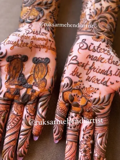 A design celebrating sisterhood for Friendship Day. One hand reads "Sisters make the best friends in the world," while the other has a portrait of two sisters.