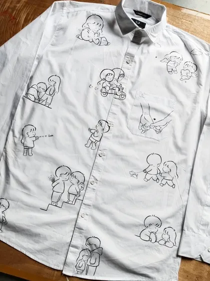 This is what I mean when I say "wear your story". I covered this entire shirt in cute, minimalist doodles that represent a couple's journey and inside jokes. It's a fun and personal way to celebrate your connection.
