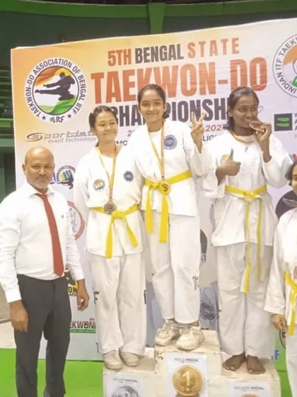 More young champions from the Bengal State Championship, proudly displaying their medals on the podium.