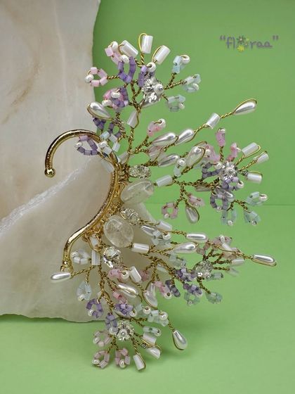 An edgy yet delicate earcuff from our FLORAA collection. I crafted this piece with soft-hued crystal beads and freshwater pearls to give a unique, statement look for a brunch or a day event.