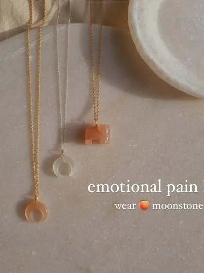 A collection of my pendants for emotional healing. The peach moonstone crescent and elephant, along with the white moonstone crescent, are all chosen for their ability to soothe emotional pain.