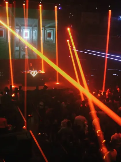Laser beams crisscrossing over the crowd at F Superclub. A great light show is essential for building the right atmosphere for a techno or progressive house set.
