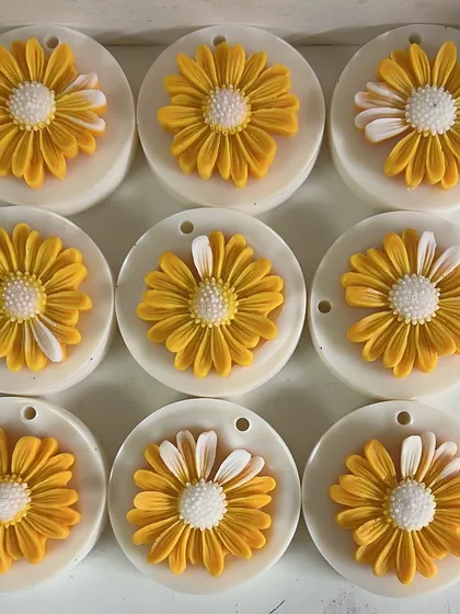 A batch of our beautiful daisy-topped wax sachets. These add a cheerful touch and a lovely scent to small spaces.