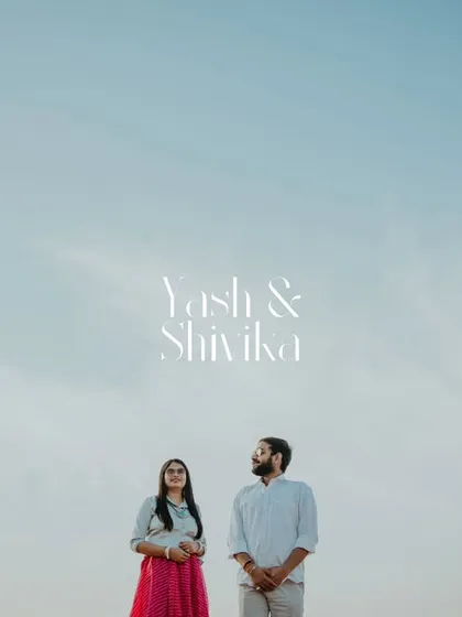 A minimalist and modern portrait against the vast blue sky of Pushkar. This artistic shot focuses on the couple, making their names the centerpiece of the image.