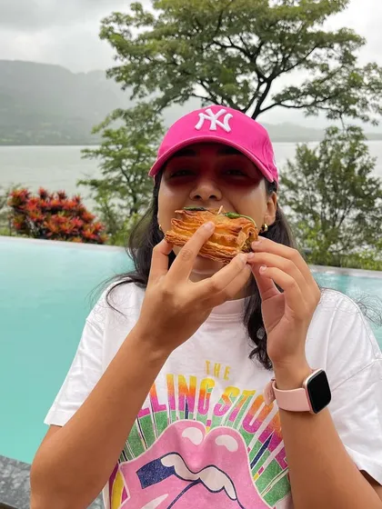 Enjoying a Baked Vada Pav Puff by the pool is the perfect way to spend a rainy day. It's my go-to comfort food.