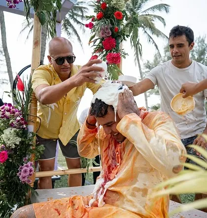 More Haldi shenanigans, with the groom getting a full 'champi' of curd and turmeric.
