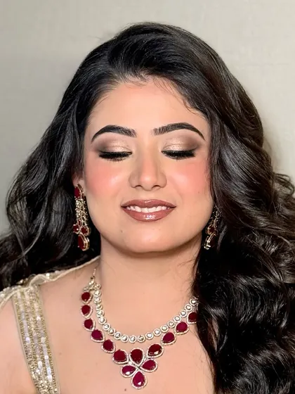 A close-up of Bhoomika's engagement makeup, showing the beautiful gold and brown tones on her eyes.