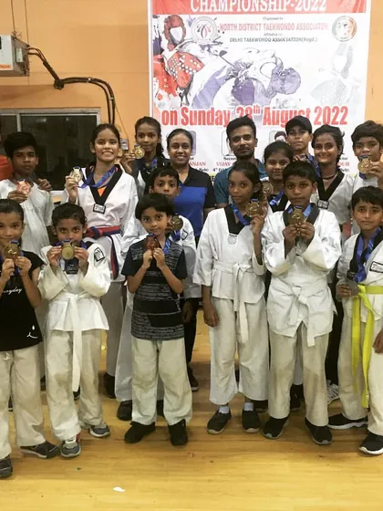 I am incredibly proud of my team from the North Districts Taekwondo Championship 2022. This group photo represents the dedication and success of our students, who consistently bring home medals.