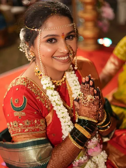 A traditional Maharashtrian bridal portrait, with the bride giving her blessings.