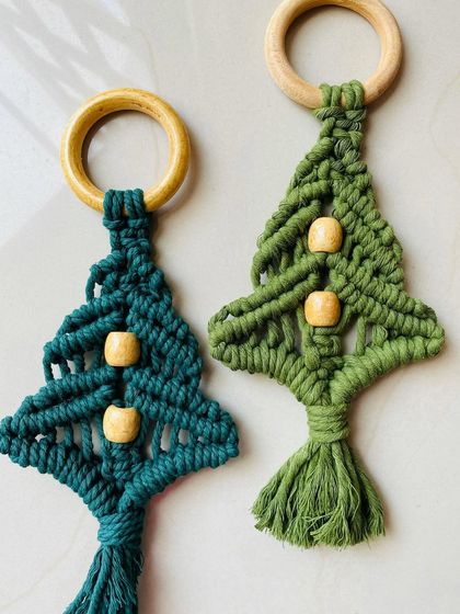 These mini macrame Christmas tree ornaments are ideal for gifting. They come with a wooden ring for easy hanging and are a sustainable choice for your holiday decor.