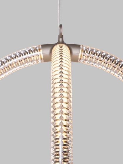 A close-up of the Luminora's structure, showing how the two interlocking rings are joined. This view provides insight into the thoughtful engineering behind the elegant design.