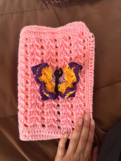 This pink book cover with a beautiful butterfly applique is a whimsical way to protect your books.