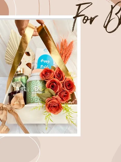 A stylish Rakhi hamper designed for both Bhaiya and Bhabhi. This triangular basket combines gifts for him and her, beautifully decorated with flowers and premium items.