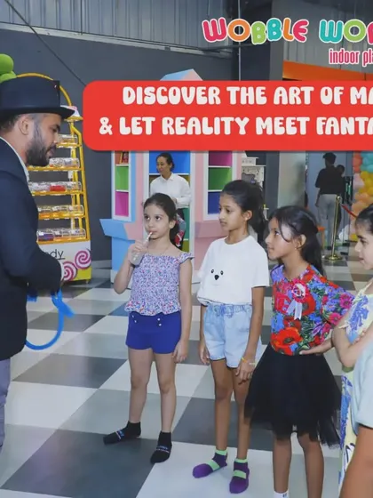 Abracadabra! A magician entertains a group of curious children. We can arrange for all kinds of entertainment to make your party extra special.