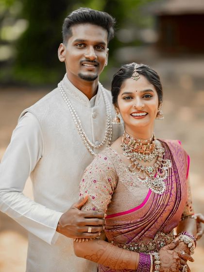 A beautiful moment between my bride Bhuvana and her groom, both styled by me. Her minimal airbrushed base and his subtle grooming created a picture-perfect look.