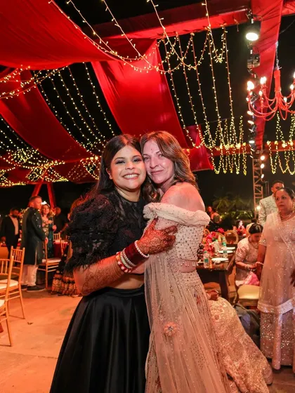 We believe a reception should feel like a galaxy of joy. For this night, we draped the sky in rich red fabric and a constellation of fairy lights, creating a warm, vibrant space where guests could share laughter and make memories under the stars.