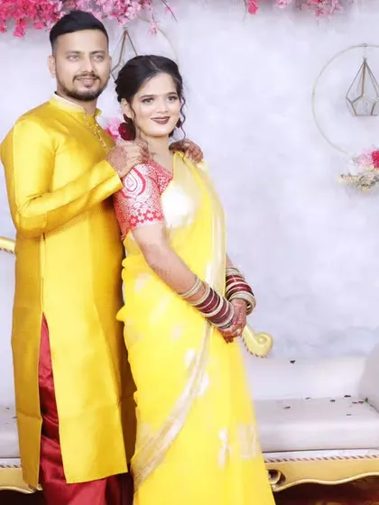 A full-length shot of the couple, looking elegant and ready for the festivities.
