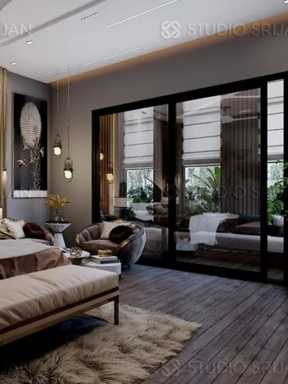 A wide view of the Alameda bedroom, showcasing the dark wood flooring, plush rug, and the large glass doors that lead to a private balcony.