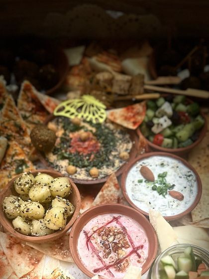 Another artistic shot of the Mezze platter, with a focus on the colourful dips and fresh salads that accompany the savoury bites.