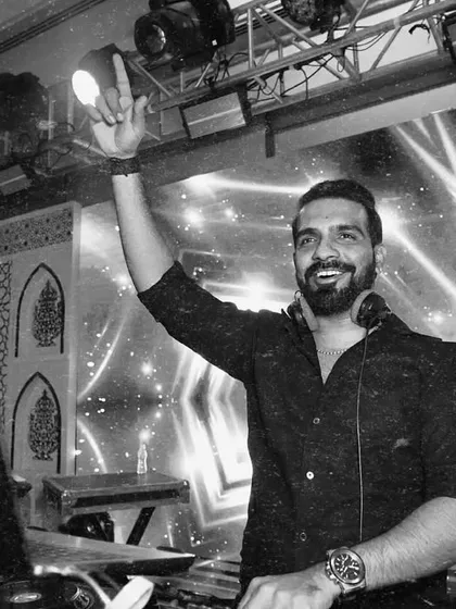 In my zone, chasing that perfect drop. These black and white shots capture the focus and joy I find in creating the perfect party atmosphere.