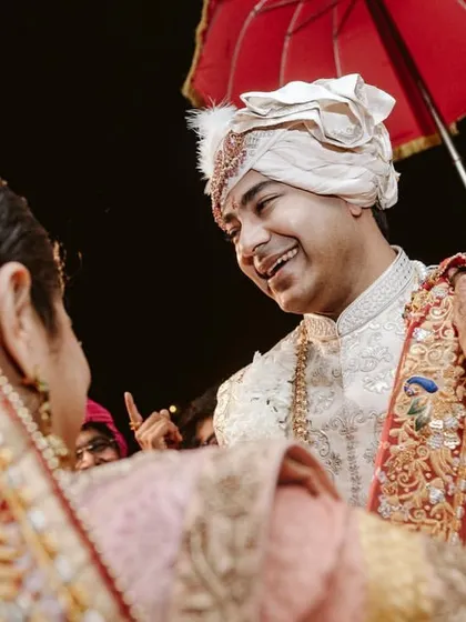 A heartwarming moment between the bride and groom during the ceremony. The genuine smiles and connection are what a perfectly planned, stress-free wedding is all about.
