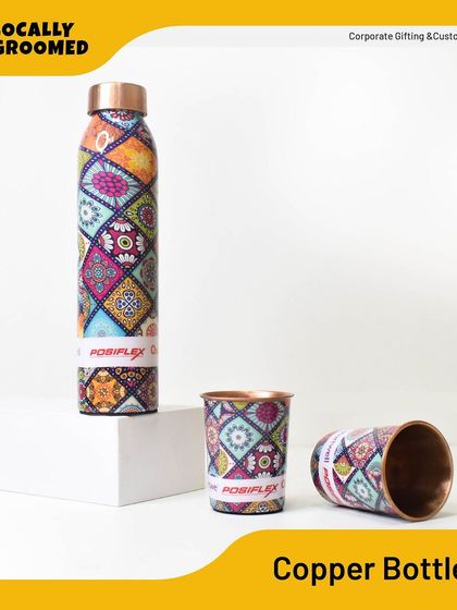 A closer look at the custom-printed copper bottle and cups for Posiflex. The intricate design and high-quality finish make this a standout corporate gift.