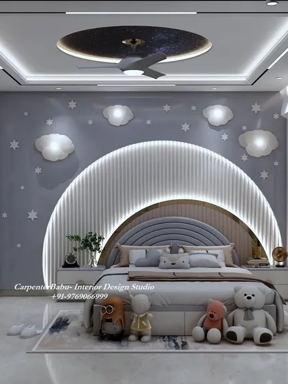 The headboard in this space-themed room is a large, backlit arch, set against a wall of stars and clouds. The teddy bears add a soft, cuddly touch.