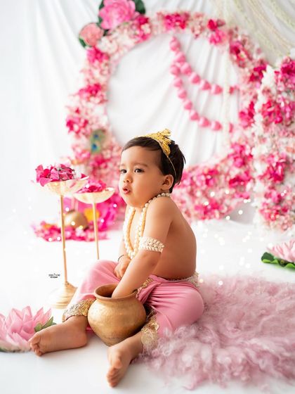 Caught in the act! This little Krishna is checking his pot for butter. An adorable and classic pose.