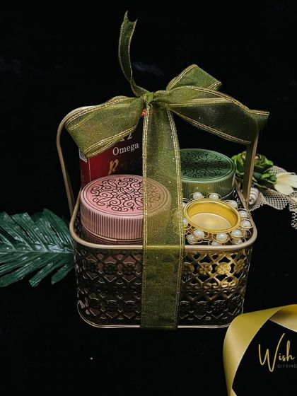 A reminder that Diwali is just around the corner. This elegant hamper with a metal basket, scented candles, and dry fruits is a preview of our festive offerings.
