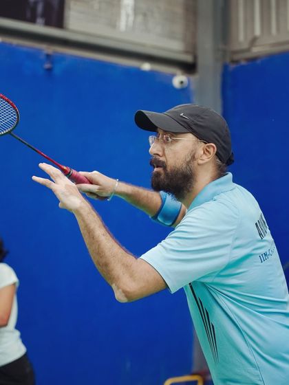 A player prepares to serve, his focus absolute. Our events allow employees to tap into their competitive side, a healthy outlet from the pressures of the office.