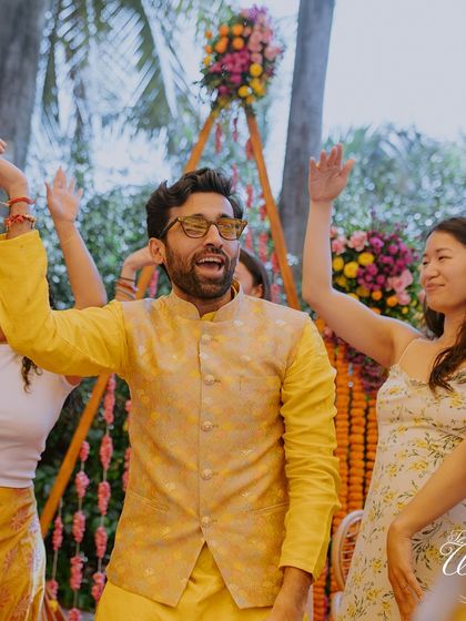 The groom letting loose on the dance floor with friends and family. A successful event is one where everyone feels free to dance and celebrate.