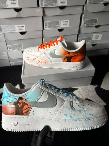 Another view of the "Salaar" custom sneakers, held up to show the detailed character art.