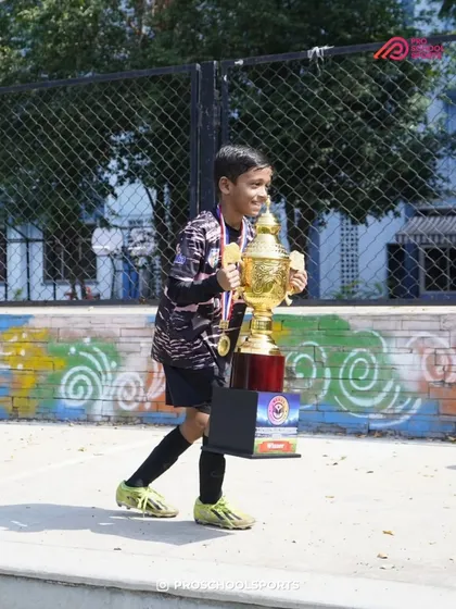 Walking away with the prize. A proud moment for this young champion after a successful tournament.