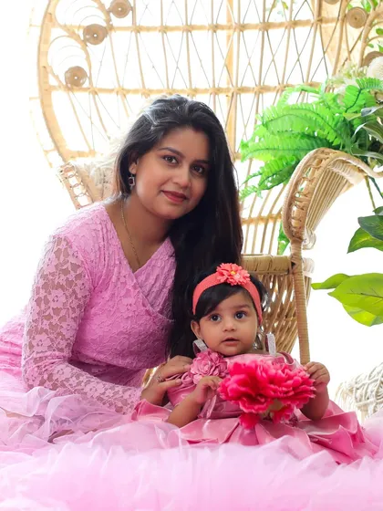 A mother and daughter duo in pretty pink outfits. I offer a selection of matching or coordinating outfits for both moms and babies to make your family portraits even more special.