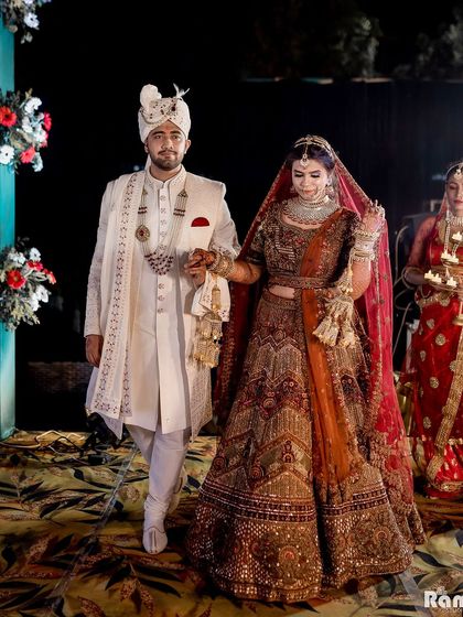 The couple's grand entrance, walking hand-in-hand down the aisle, ready to begin their new life together.