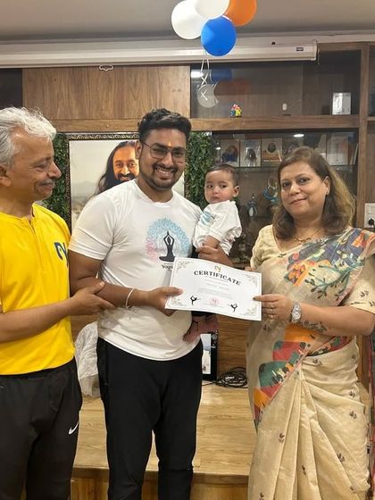 The second runner-up team, "Early Risers," even had our youngest member join the celebration. It's a family affair at Nikki Yoga Studio.