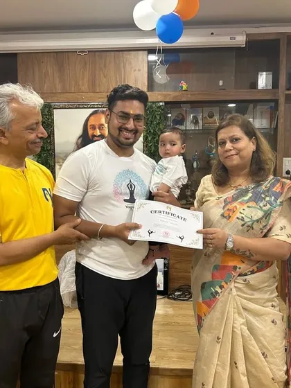 The second runner-up team, "Early Risers," even had our youngest member join the celebration. It's a family affair at Nikki Yoga Studio.