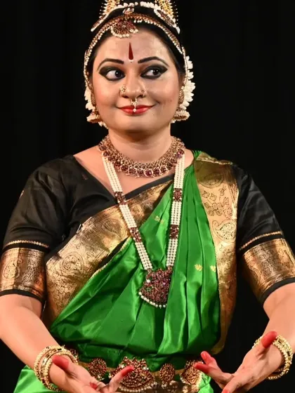 A close-up of the Kuchipudi artist, showcasing the intricate costume and expression. BRAVO!