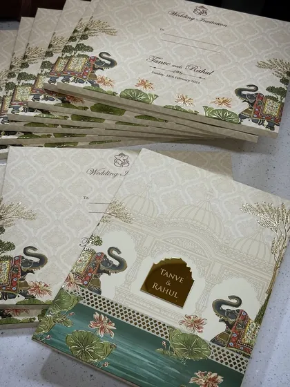 A bestseller hardback invitation featuring a classic design with royal elephants and lotus motifs. This timeless card is perfect for any traditional Indian wedding.