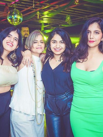 A group of friends posing for a photo.