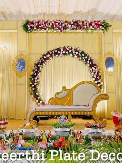 This engagement setup at VSG Mahal features a beautiful floral arch backdrop. My platter arrangements in the front are designed to match the grandeur of the stage.