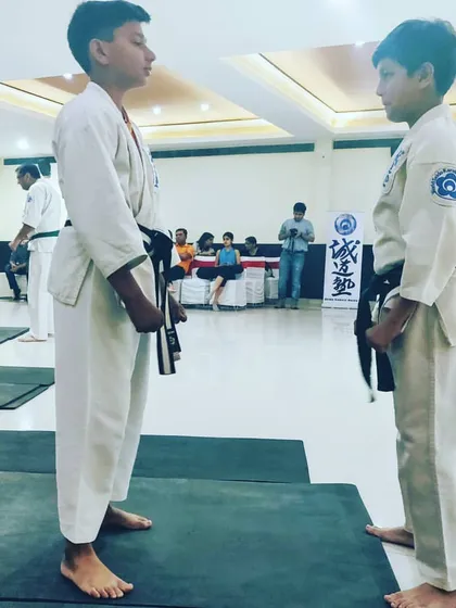Before any drill, we learn respect. Two of our young students face each other before beginning a self defense demonstration, a core principle of martial arts.