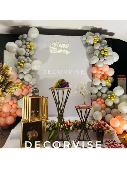 This is another view of a modern birthday decor setup I offer. It highlights the arrangement of decorative crates and pedestals, which can be used to display cakes, gifts, or floral arrangements to complete the look.