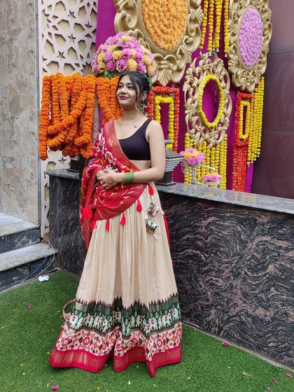 A full view of this beautiful ethnic lehenga against a festive backdrop. The colors and patterns come together to create a look that is perfect for any wedding function.
