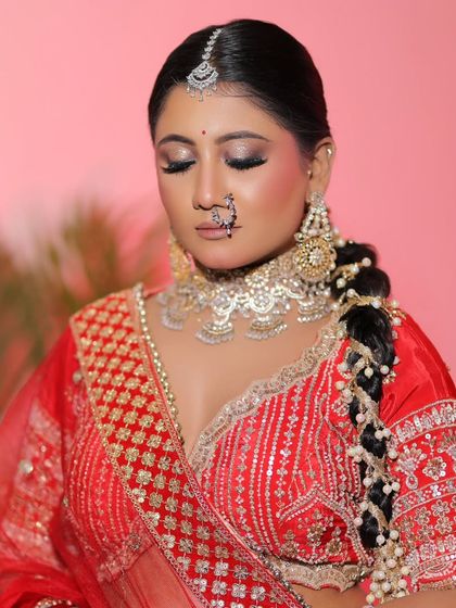 A close-up on the eye makeup. The shimmering gold and deep black liner create a dramatic and beautiful effect.