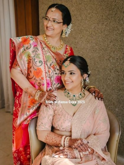 A beautiful moment between a bride and her mother. Being a part of these quiet, love-filled moments is a privilege, and her elegant mehendi completes her timeless bridal look.