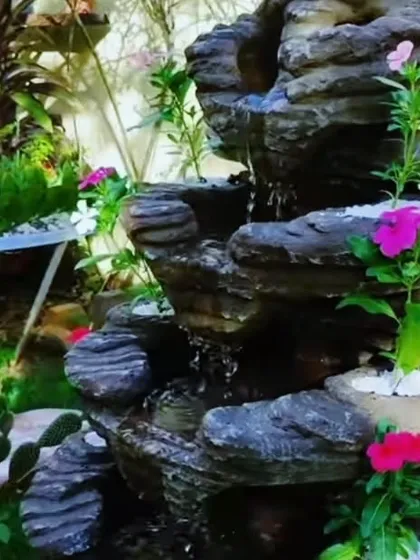 A close up of a small rock waterfall we installed. The sound of flowing water adds a very calming feeling to any garden, big or small.
