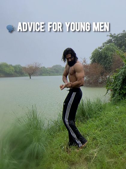 Some advice for young men. A shot of me posing by the lake, a reminder to focus on self-improvement and building a strong foundation in life.