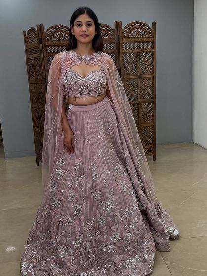 A full-length shot showcasing the entire modern silhouette of the cape lehenga. A true gem from my pre-loved collection.